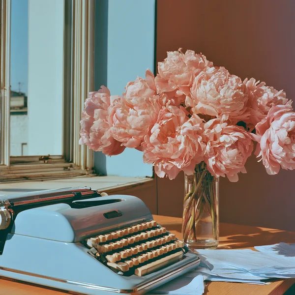 Vintage Typewriter and Peonies on a Desk