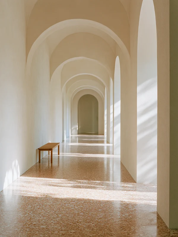 Sunlit Corridor with Arched Passageways