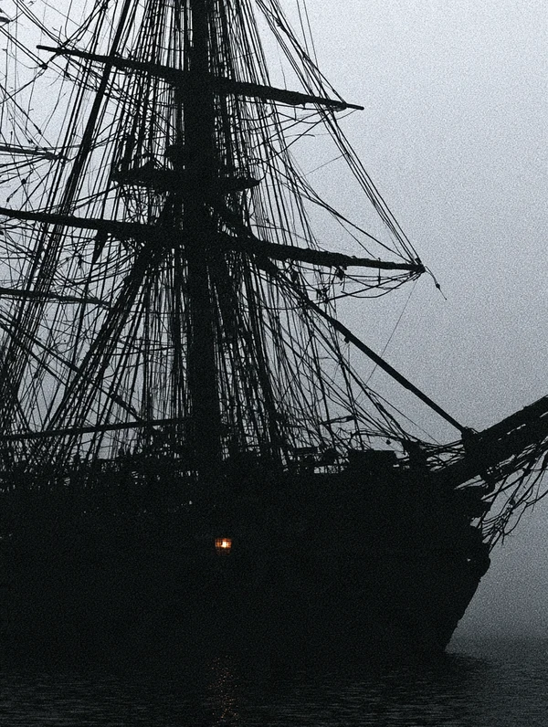 Silhouette of a Tall Ship in the Fog