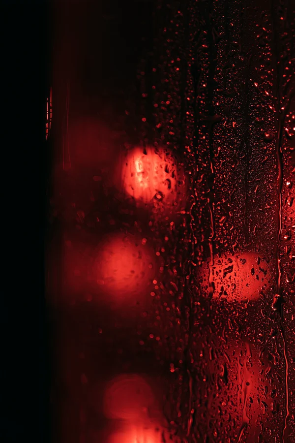Red Raindrops on Glass