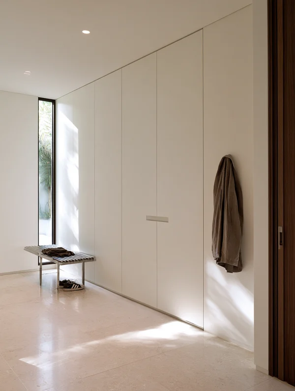 Minimalist Hallway with Storage Wall and Bench