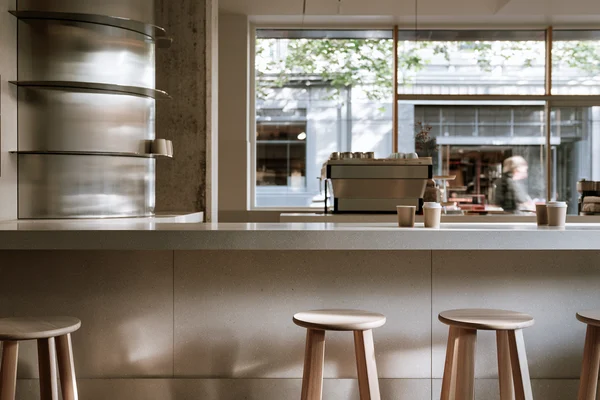 Minimalist Coffee Shop Counter and Stools