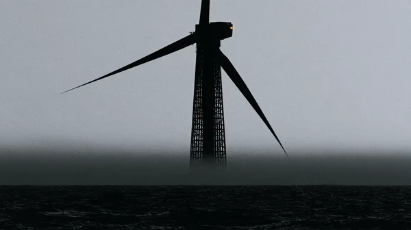 Offshore Wind Turbine in Misty Sea