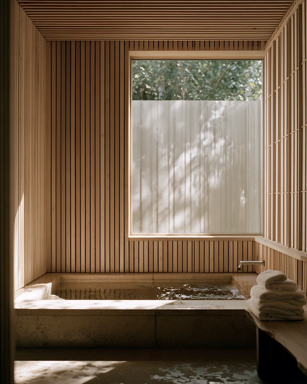 Serene Sunken Stone Bath in Wooden Spa Room