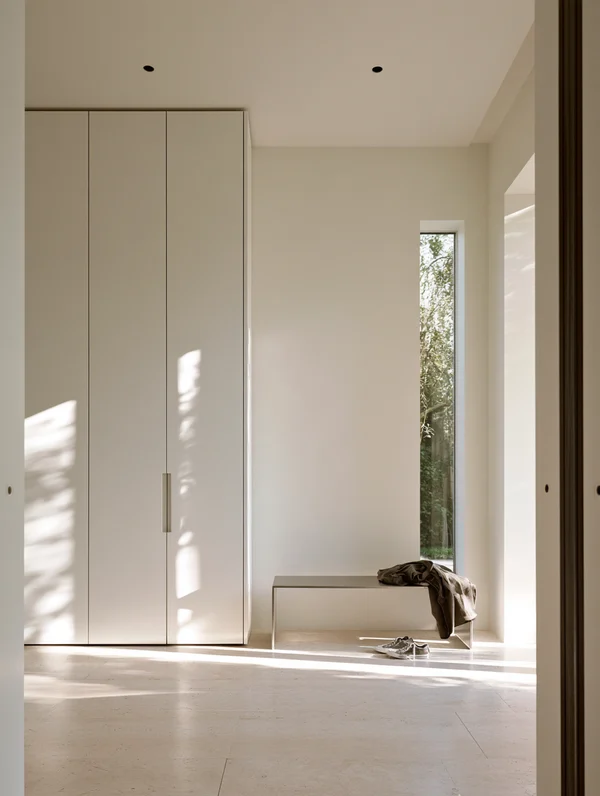 Minimalist Entrance Hall with Storage and Bench