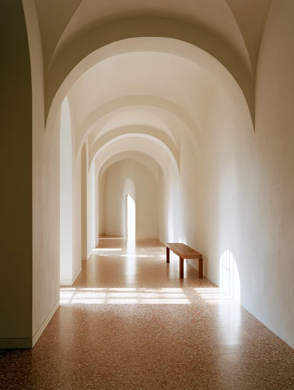 Sunlit Corridor with Arched Ceilings