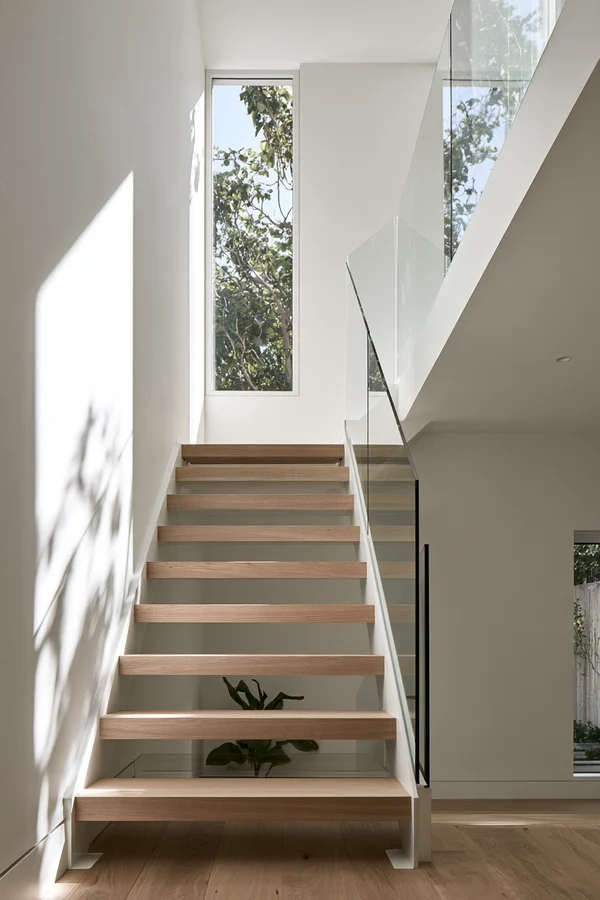 Modern Minimalist Staircase with Glass Railing
