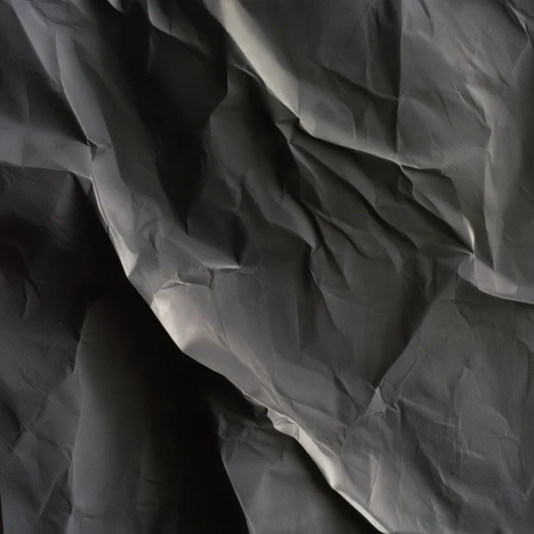 Crumpled Dark Paper Surface