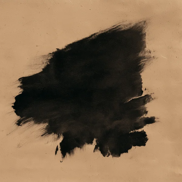 Black Ink Stain on Tan Paper